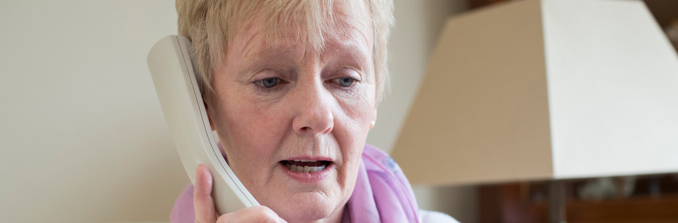 Senior Woman Giving Credit Card Details On The Phone