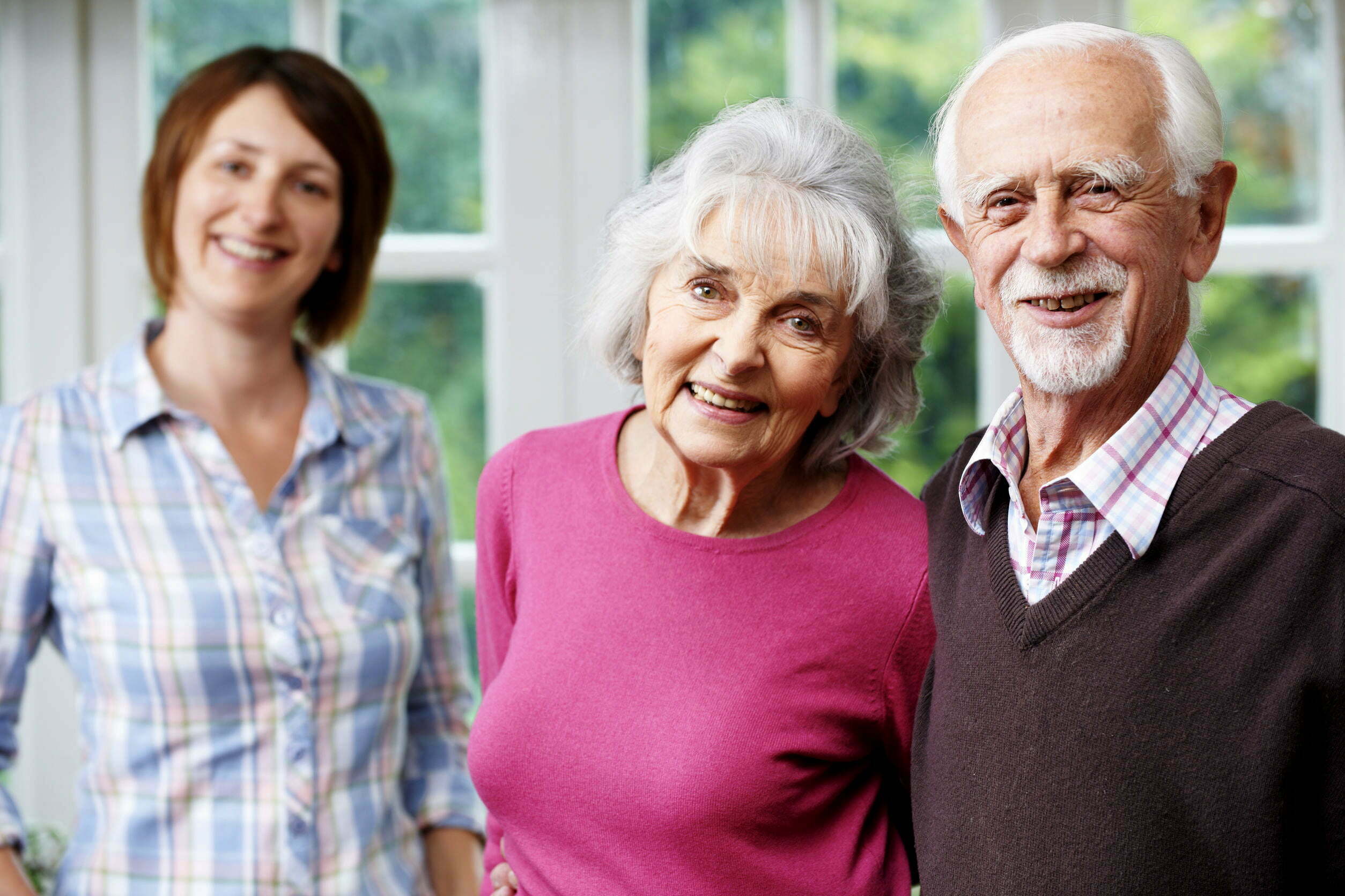 Older adult couple and daughter