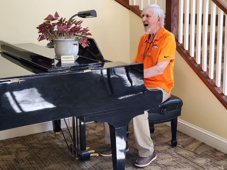 Elderly man playing the piano