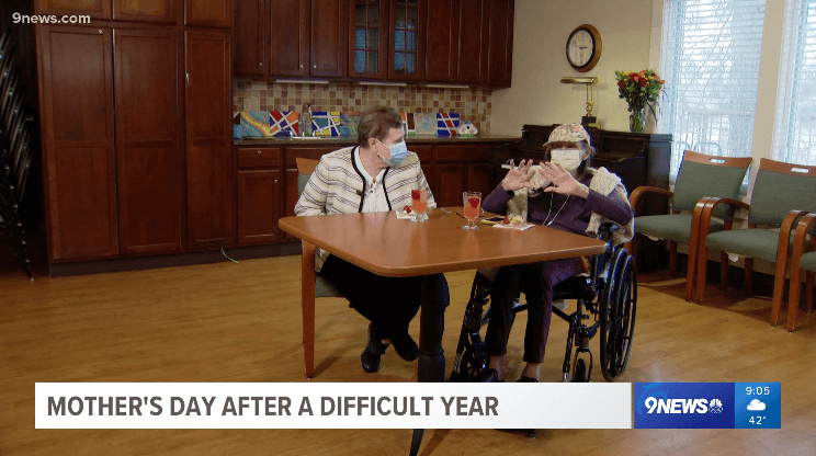 Two Someren Glen residents being interviewed while sitting at a table.