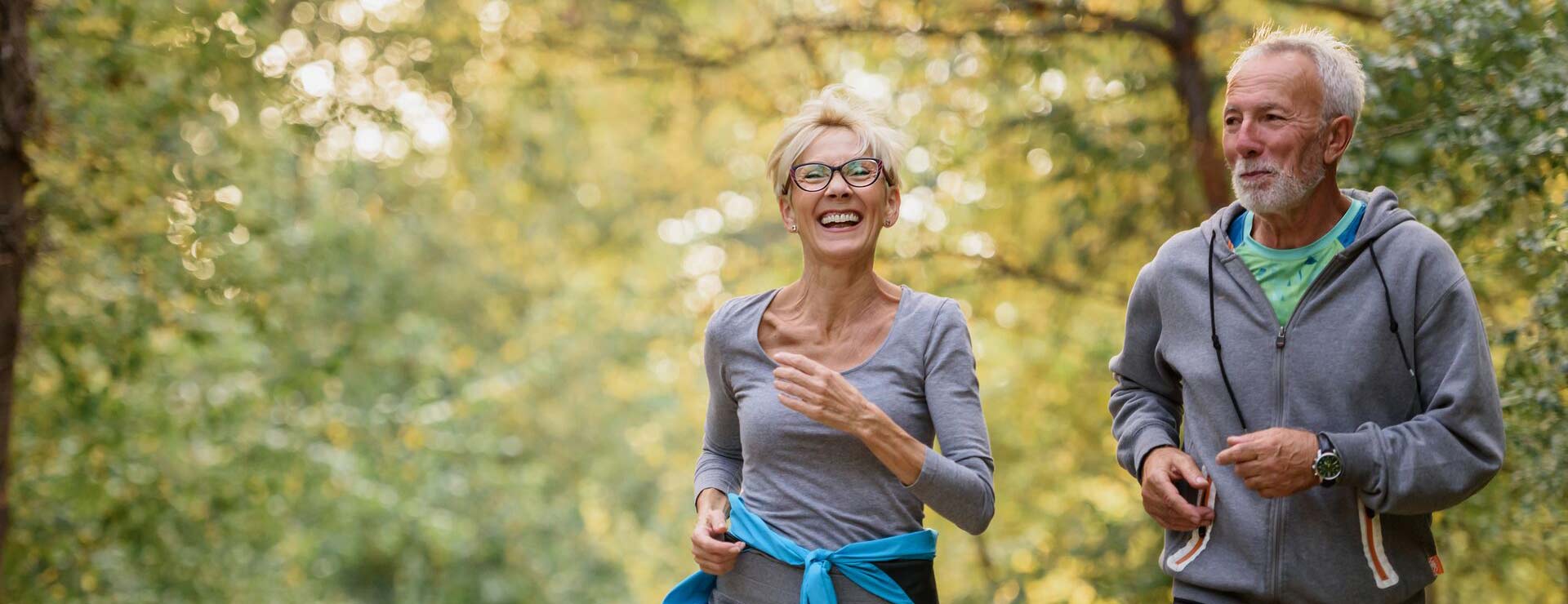 Man and woman take a jog outside.