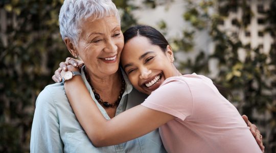 Shot of a senior woman spending time with her daughter in their garden at home