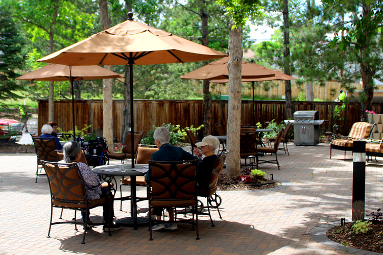 Senior living residents in outdoor courtyard